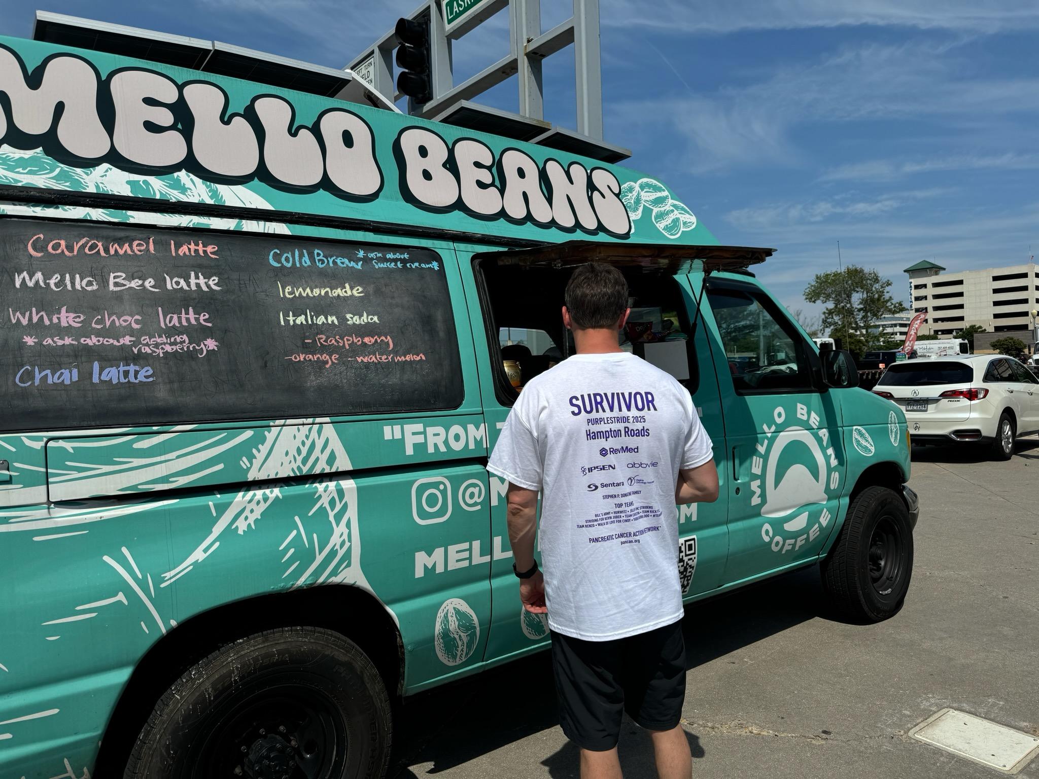 Mello Beans coffee van with a person standing next to it on a street. Virginia Beach; Coffee; Mobile coffee; Coffee near me; local coffee